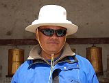 Mustang Lo Manthang 02 02 Nepalese Guide Gyan Tamang In Front Of Kings Palace My guide Gyan Tamang poses in his new Tibetan hat in front of the King�s Palace in Lo Manthang. Cool.
